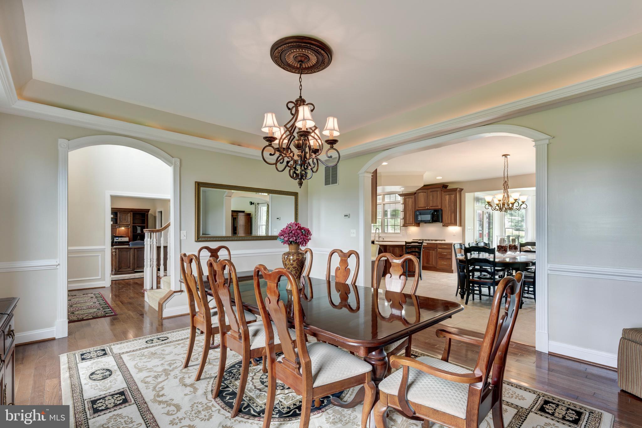 2995 Sams Creek Road New Windsor, MD 21776 - Photo 43 of 126 a view of a dining room with furniture and chandelier