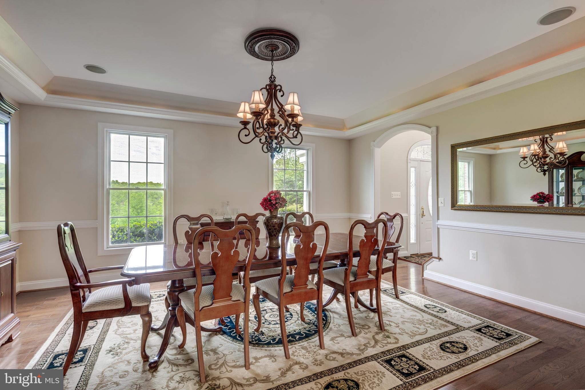 2995 Sams Creek Road New Windsor, MD 21776 - Photo 44 of 126 a view of a dining room with furniture and chandelier