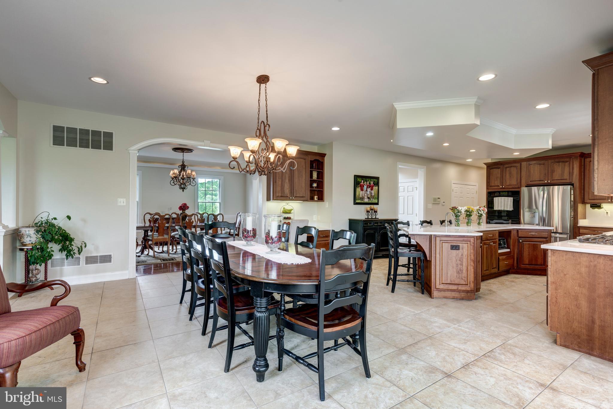 2995 Sams Creek Road New Windsor, MD 21776 - Photo 49 of 126 a view of a dining room with furniture and chandelier