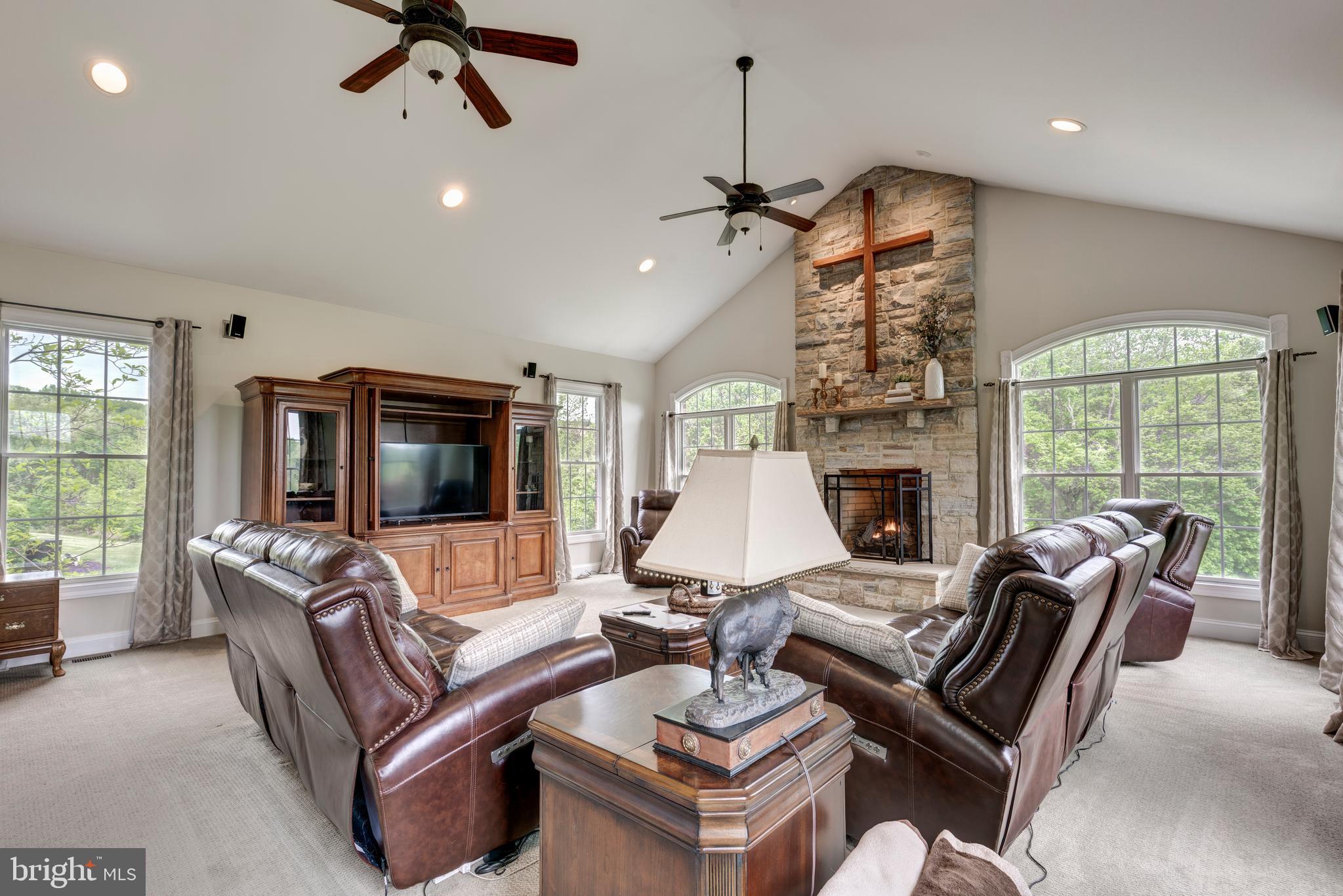 2995 Sams Creek Road New Windsor, MD 21776 - Photo 60 of 126 a living room with furniture ceiling fan and a flat screen tv