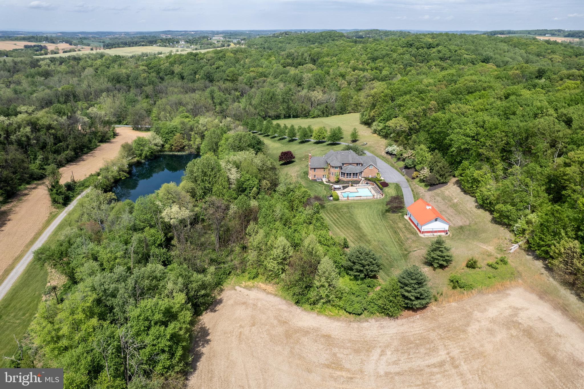 2995 Sams Creek Road New Windsor, MD 21776 - Photo 7 of 126 a view of a garden with a building in the background