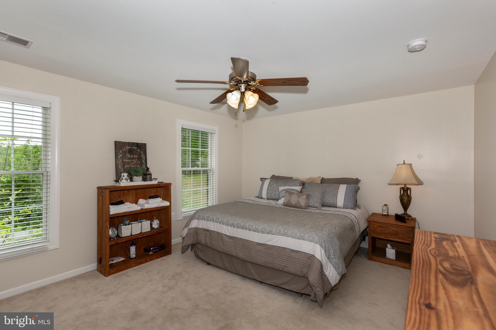 2995 Sams Creek Road New Windsor, MD 21776 - Photo 77 of 126 a bedroom with a bed and a window