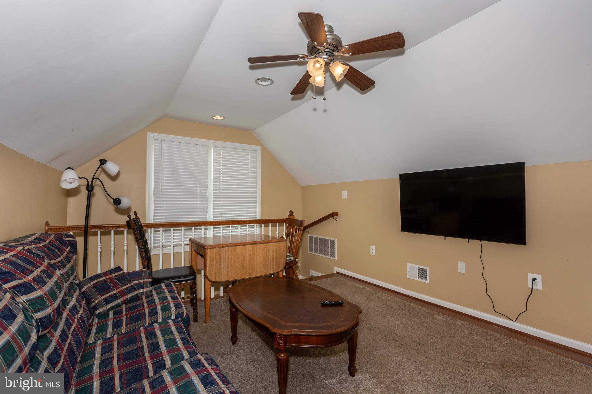 2995 Sams Creek Road New Windsor, MD 21776 - Photo 86 of 126 a living room with furniture and a flat screen tv