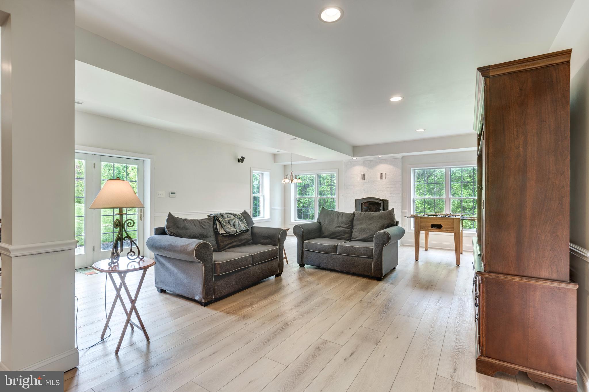 2995 Sams Creek Road New Windsor, MD 21776 - Photo 95 of 126 a living room with furniture and a wooden floor