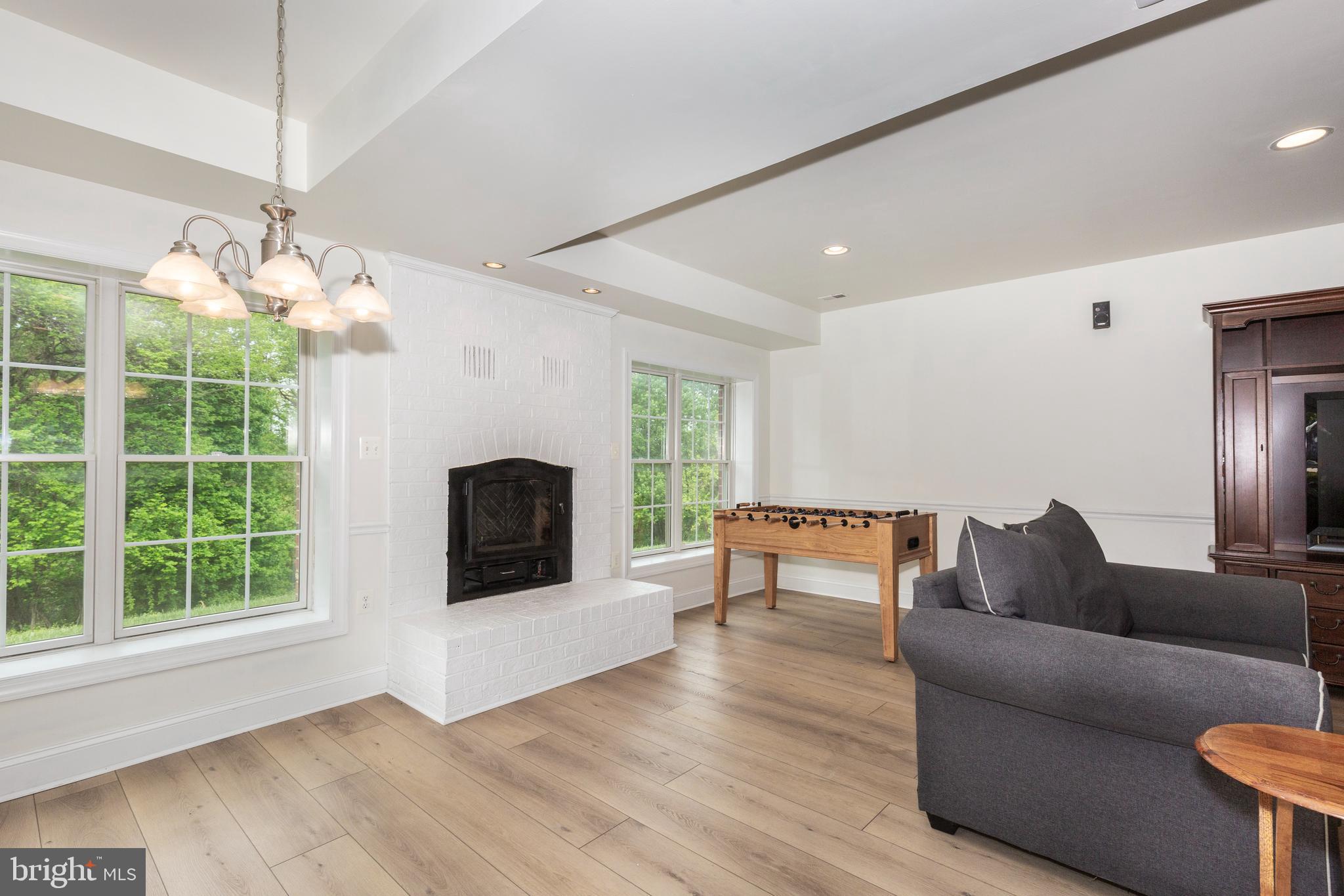 2995 Sams Creek Road New Windsor, MD 21776 - Photo 96 of 126 a living room with furniture and a fireplace