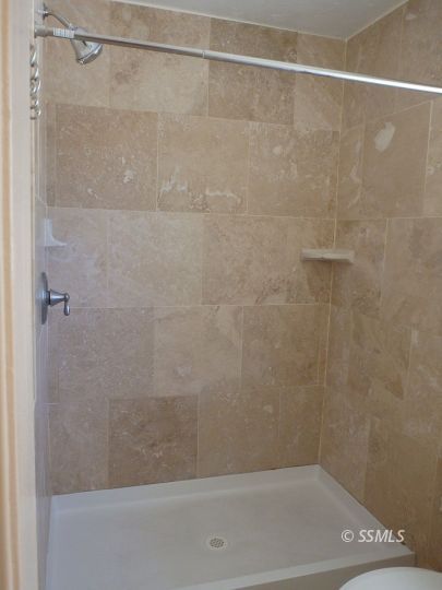 723 West Kevin Court Ridgecrest, CA 93555 - Photo 29 of 48 a bathroom with a shower and a bath tub
