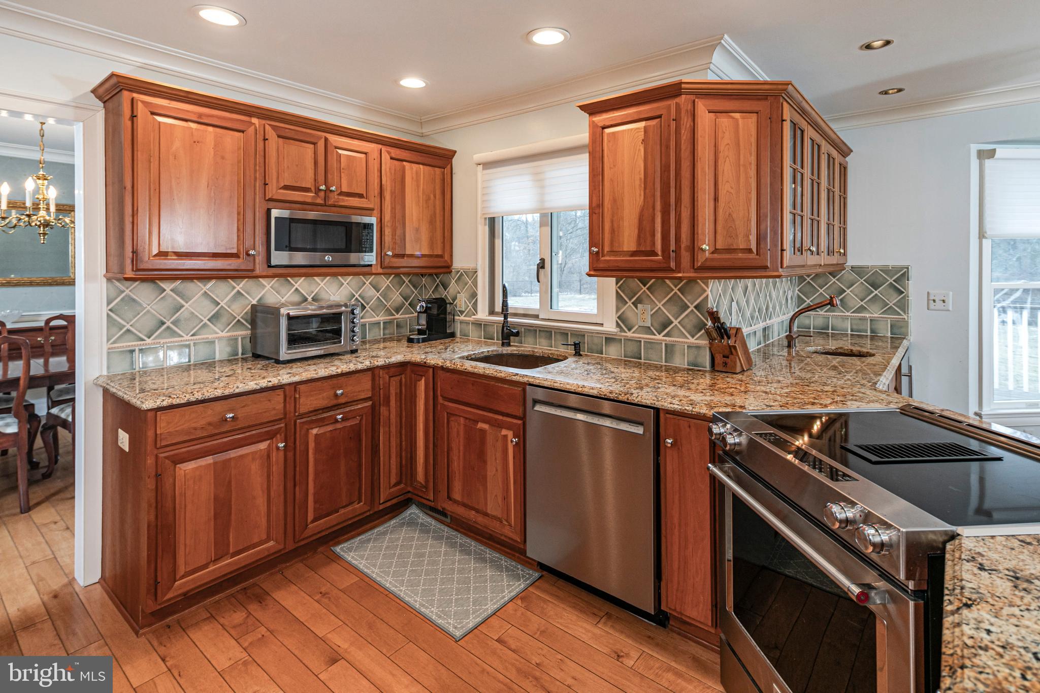 6 Nelson Ridge Road Princeton, NJ 08540 - Photo 12 of 41 a kitchen with stainless steel appliances granite countertop a sink stove and cabinets