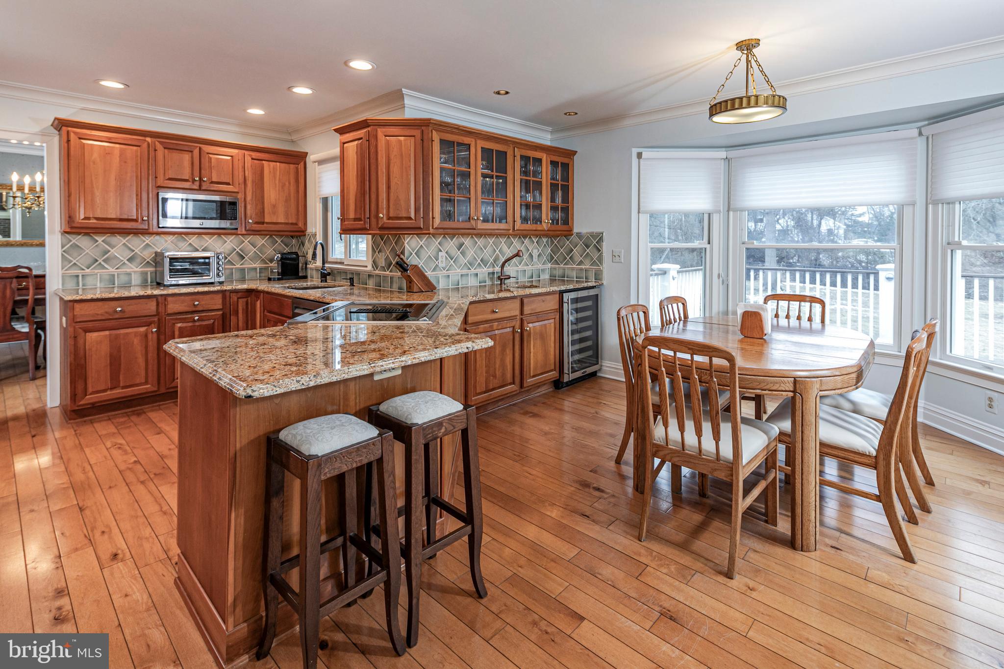 6 Nelson Ridge Road Princeton, NJ 08540 - Photo 13 of 41 a large kitchen with granite countertop a stove a sink a dining table and chairs
