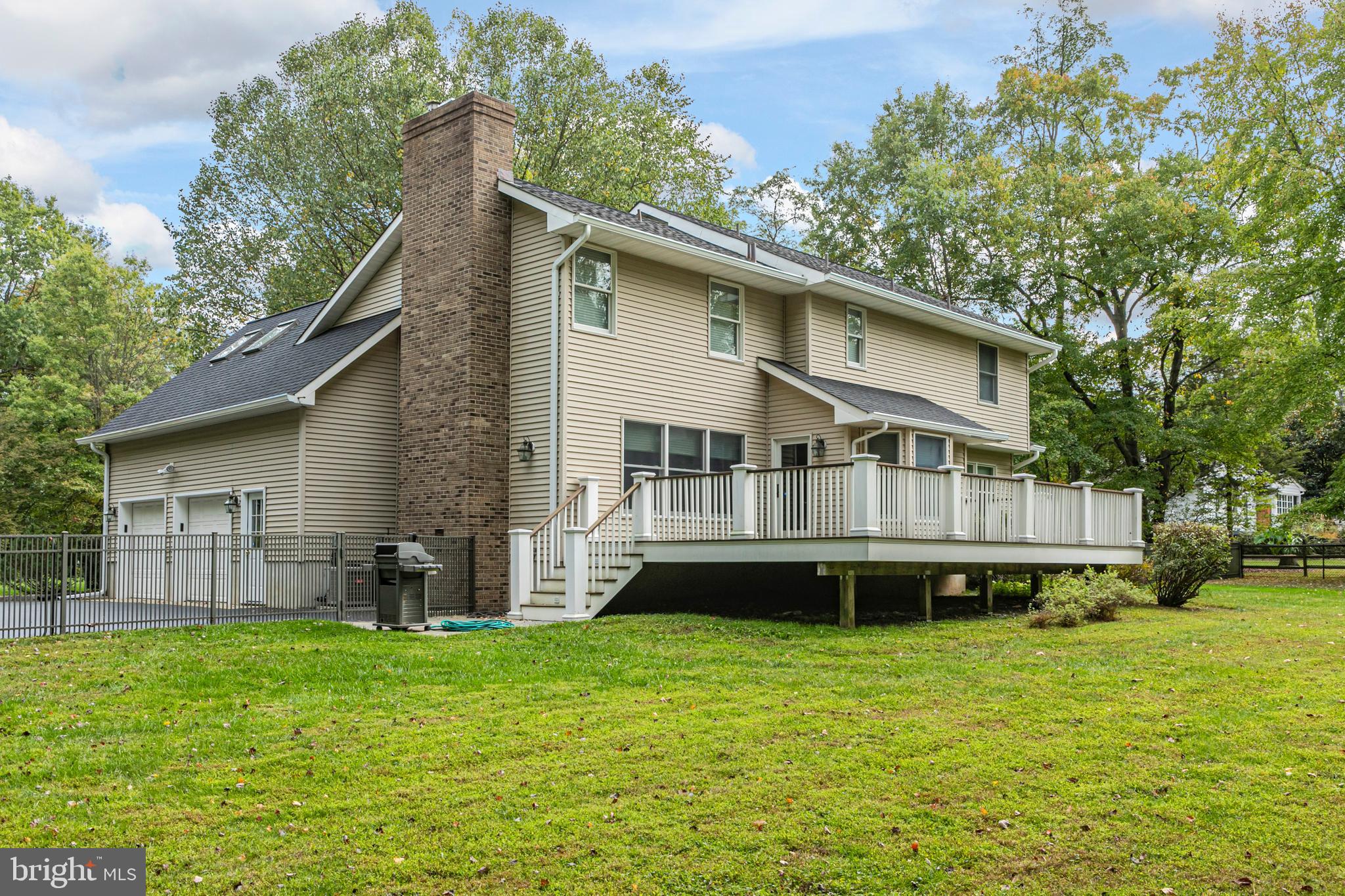 6 Nelson Ridge Road Princeton, NJ 08540 - Photo 40 of 41 a front view of a house with a garden and deck