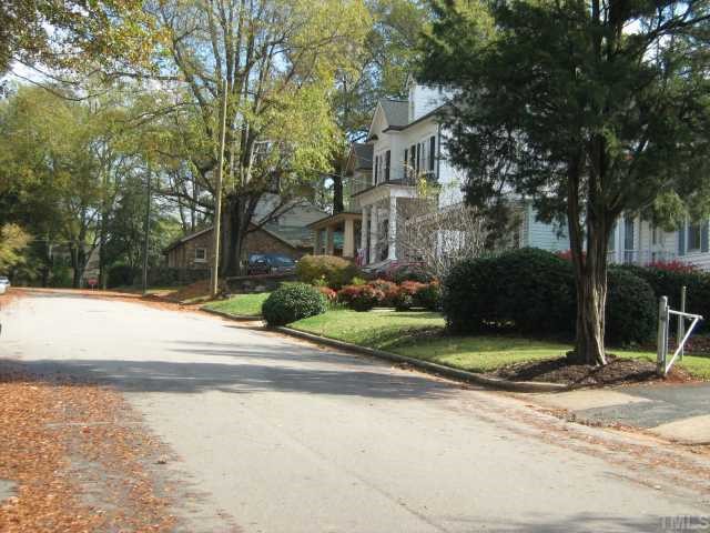 Lot 15 Davis, Unit 15 Raleigh, NC 27608 - Photo 3 of 5 a view of a house with a yard and large tree and plants