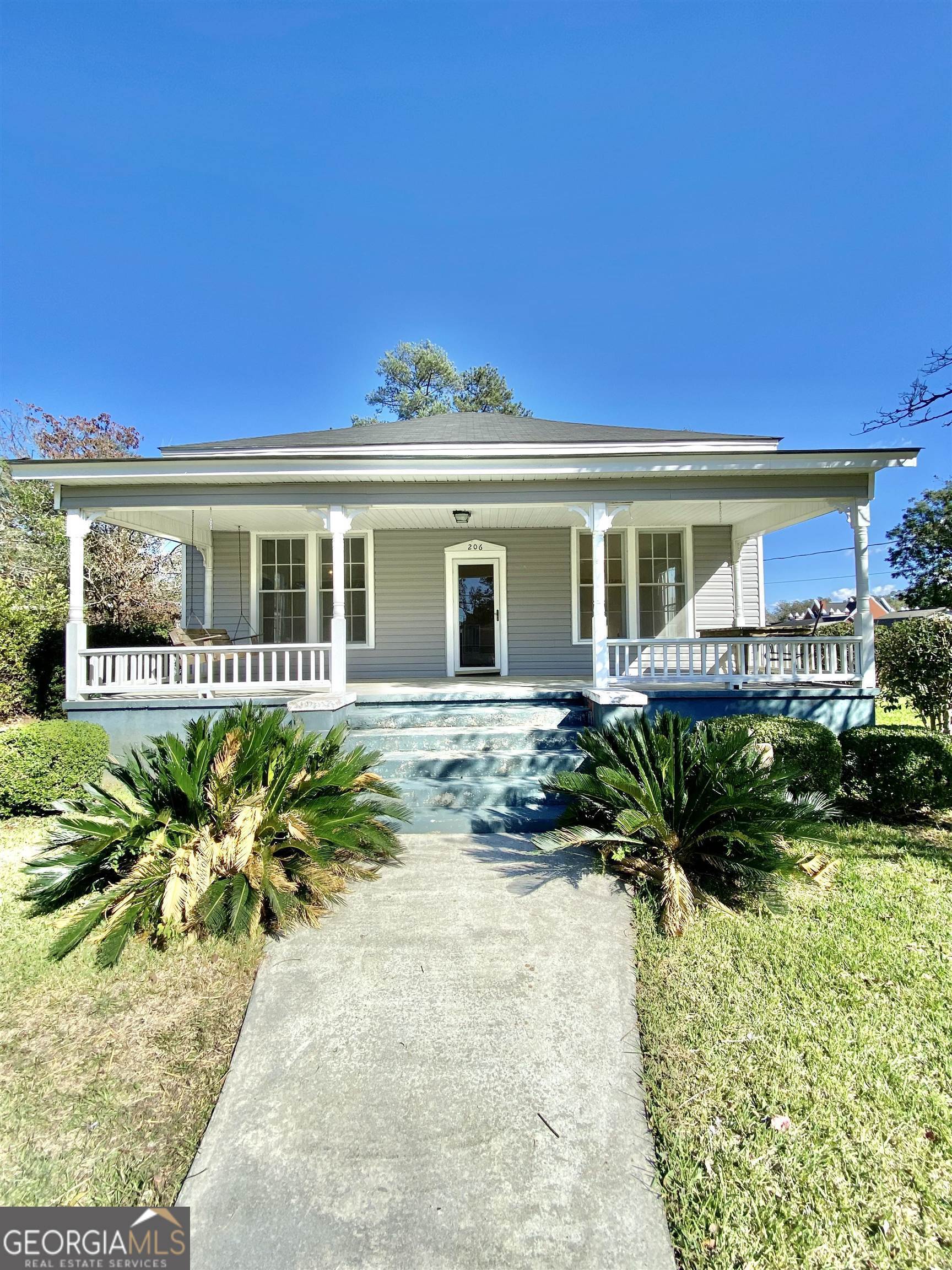 front view of a house with a yard