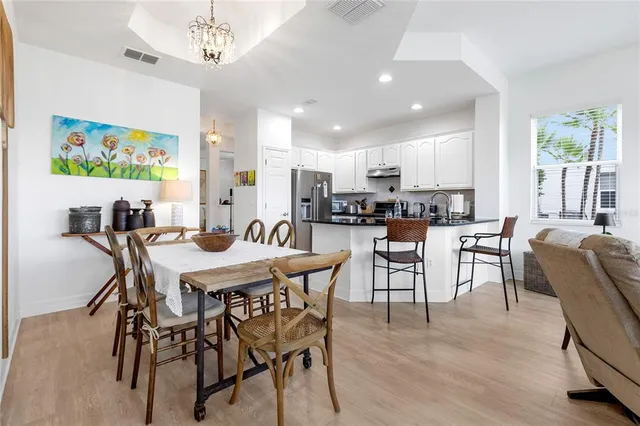 a kitchen with a white cabinets and white appliances