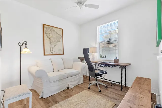 a bed room with a bed and a flat tv screen on dresser