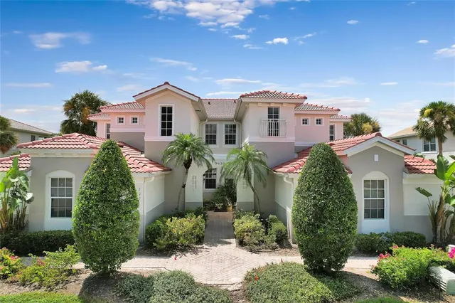 an aerial view of a house with a lake view