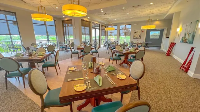 an aerial view of a houses with a lake view