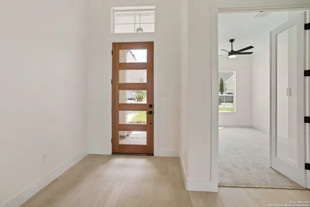 an empty room that has a window in it