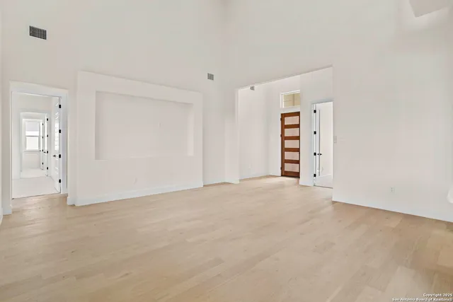 a view of an empty room with a closet
