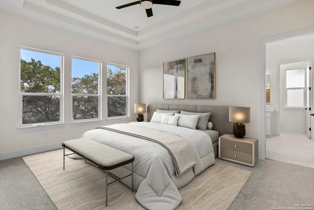 a bedroom with a large bed and a large window