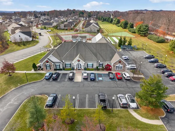 an aerial view of houses with a swimming pool