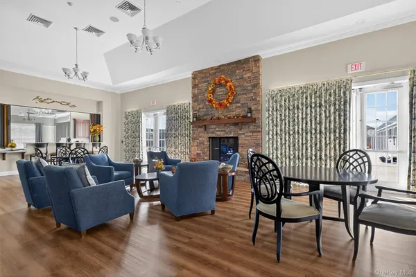 a living room with furniture wooden floor and a fireplace
