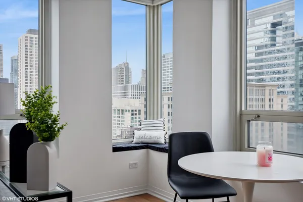 a dining room with furniture and window