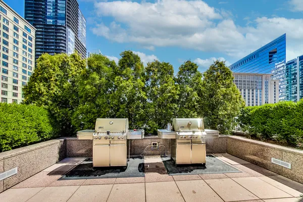 a view of a patio with table and chairs with potted plants