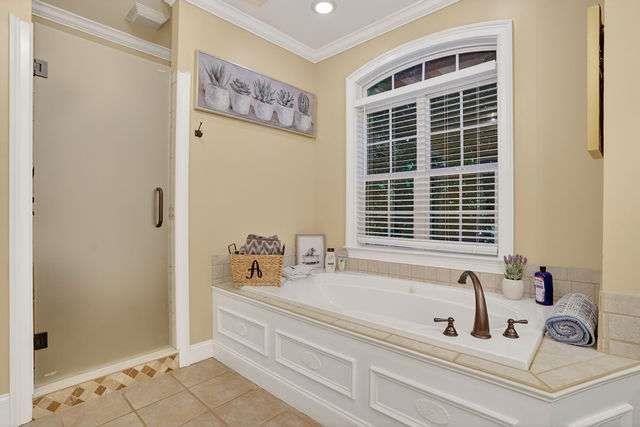 8179 Pineview Court Villa Rica, GA 30180 - Photo 18 of 41 a bathroom with a bathtub and a shower