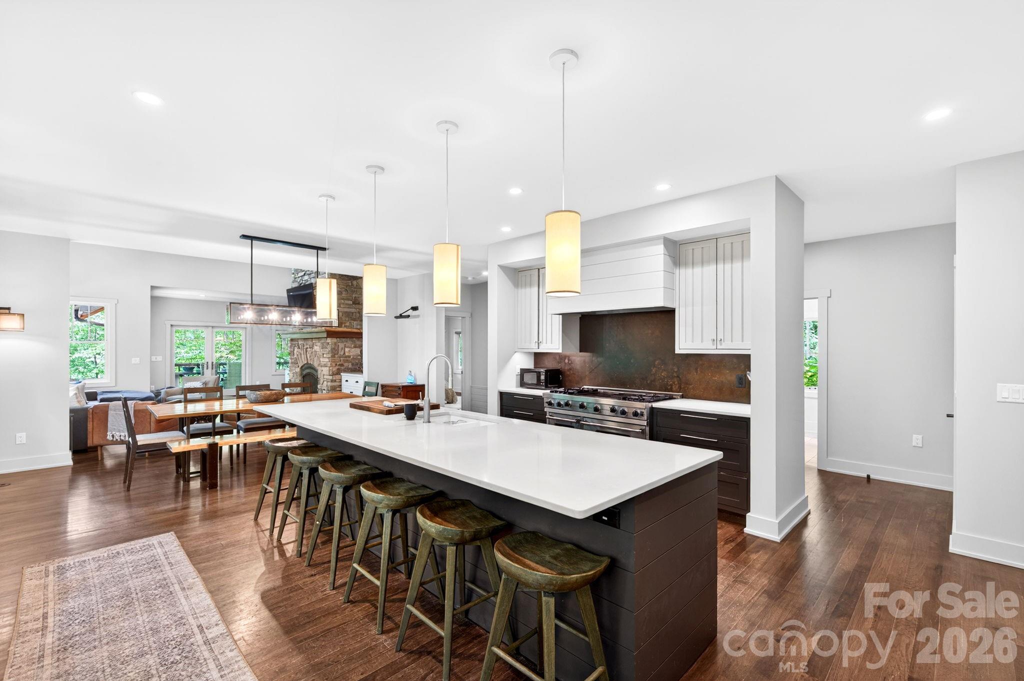 235 Bull Creek Road Asheville, NC 28805 - Photo 6 of 47 a large kitchen with a table and chairs