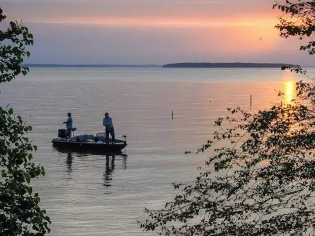 a view of a terrace with wooden floor and lake view