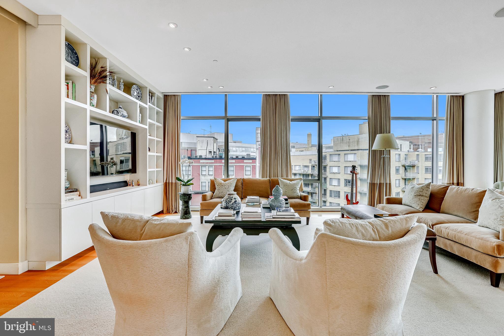 1177 22nd Street Northwest, Unit 7G Washington, DC 20037 - Photo 3 of 33 Living Room with floor-to-ceiling windows