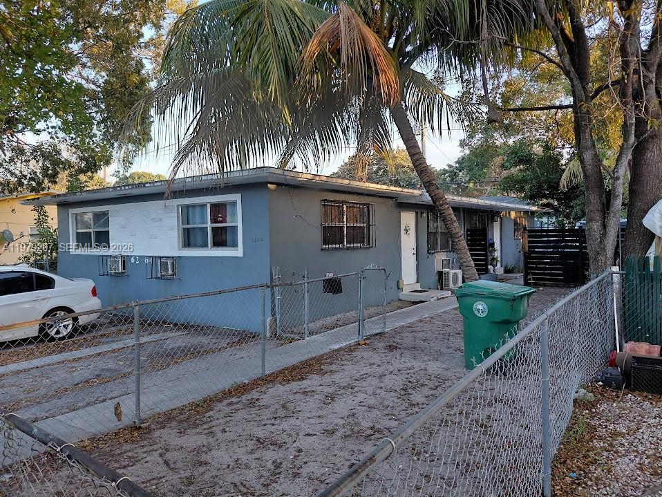 1262 Northwest 46th Street Miami, FL 33142 - Photo 9 of 11 a view of a house with a patio