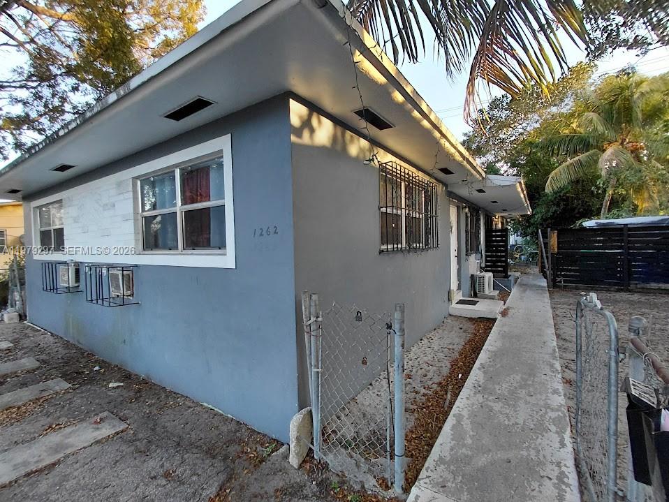 1262 Northwest 46th Street Miami, FL 33142 - Photo 10 of 11 a view of a house with a backyard