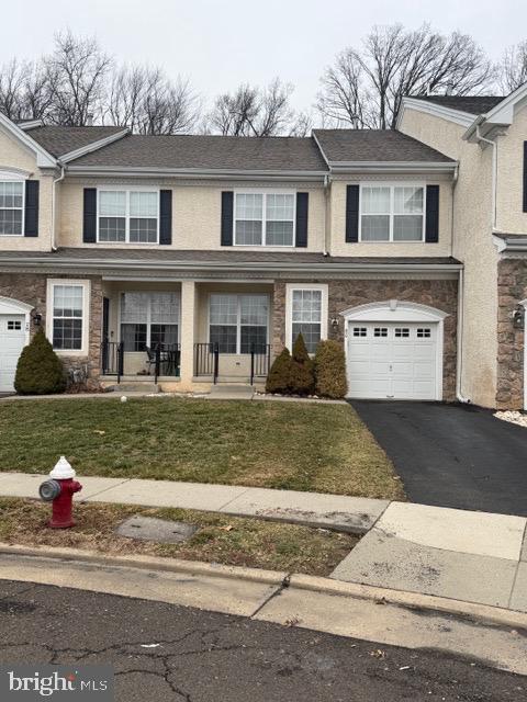 80 Brecknock Court Newtown, PA 18940 - Photo 1 of 22 a front view of a house with a yard and garage