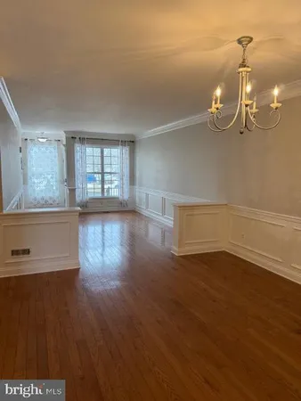 a view of a livingroom with wooden floor