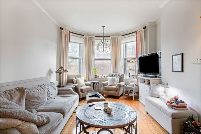 a living room with furniture fireplace and a flat screen tv