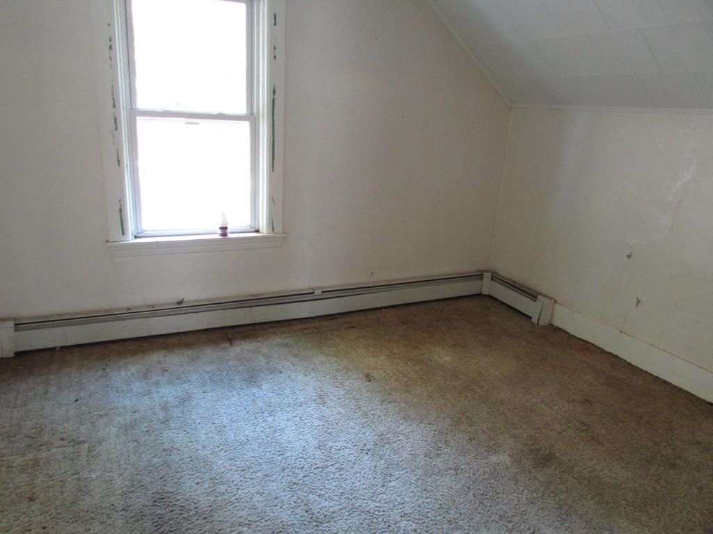 60 Brookfield Road Charlton, MA 01507 - Photo 13 of 14 an empty room with a window