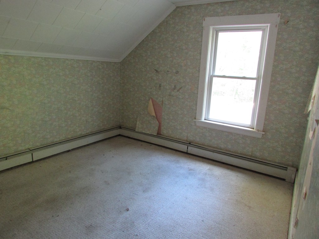 60 Brookfield Road Charlton, MA 01507 - Photo 14 of 14 an empty room with a window