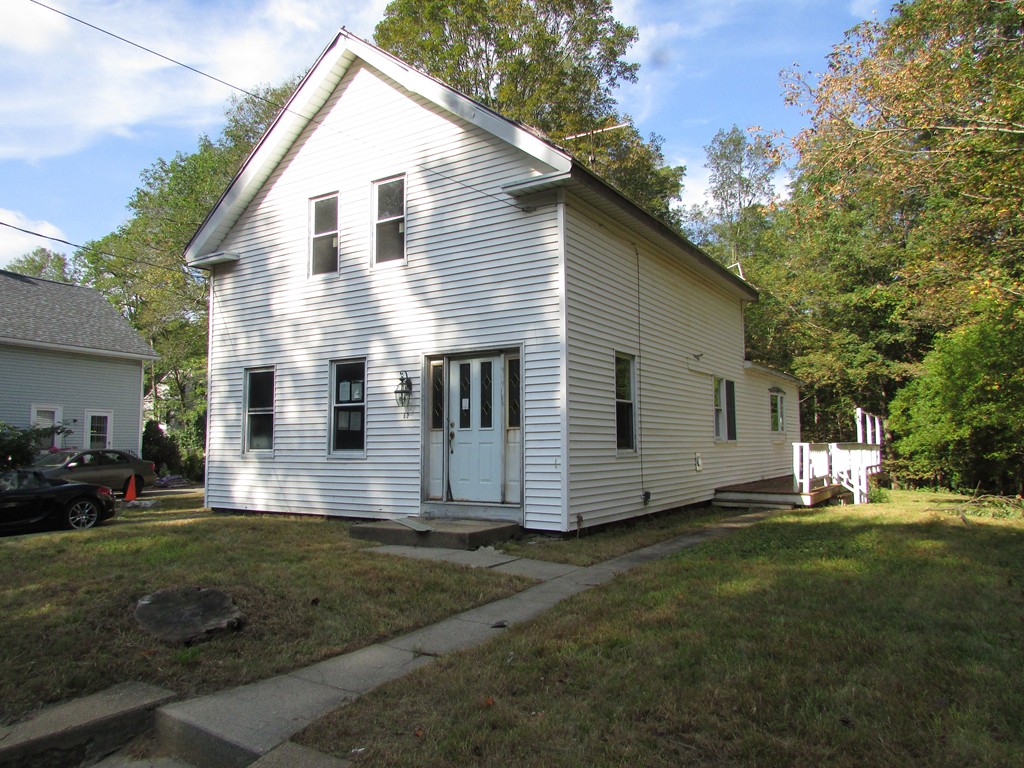 60 Brookfield Road Charlton, MA 01507 - Photo 2 of 14 a view of a back yard of the house