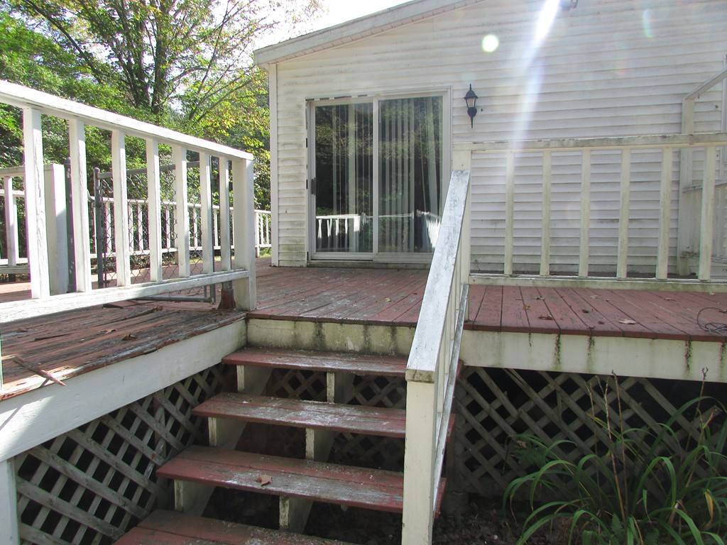 60 Brookfield Road Charlton, MA 01507 - Photo 5 of 14 a view of a balcony with an outdoor space
