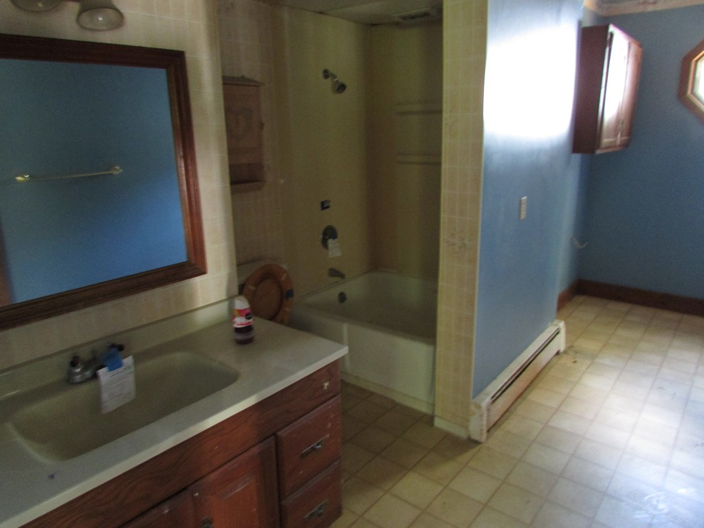 60 Brookfield Road Charlton, MA 01507 - Photo 9 of 14 a bathroom with a sink and a mirror