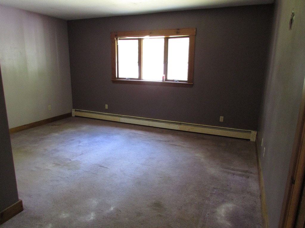 60 Brookfield Road Charlton, MA 01507 - Photo 10 of 14 an empty room with a window