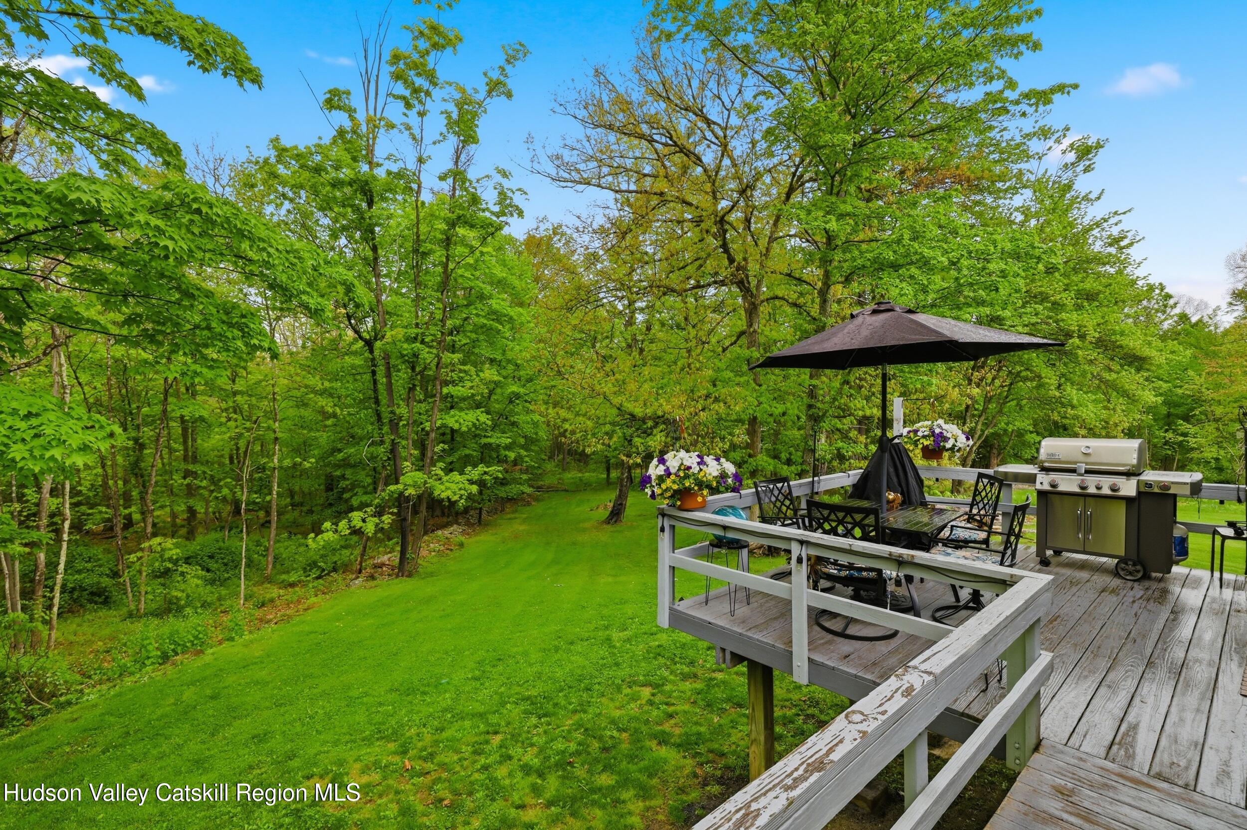 186 Cedar Hill Road High Falls, NY 12440 - Photo 29 of 33 a view of a deck with wooden floor and a garden