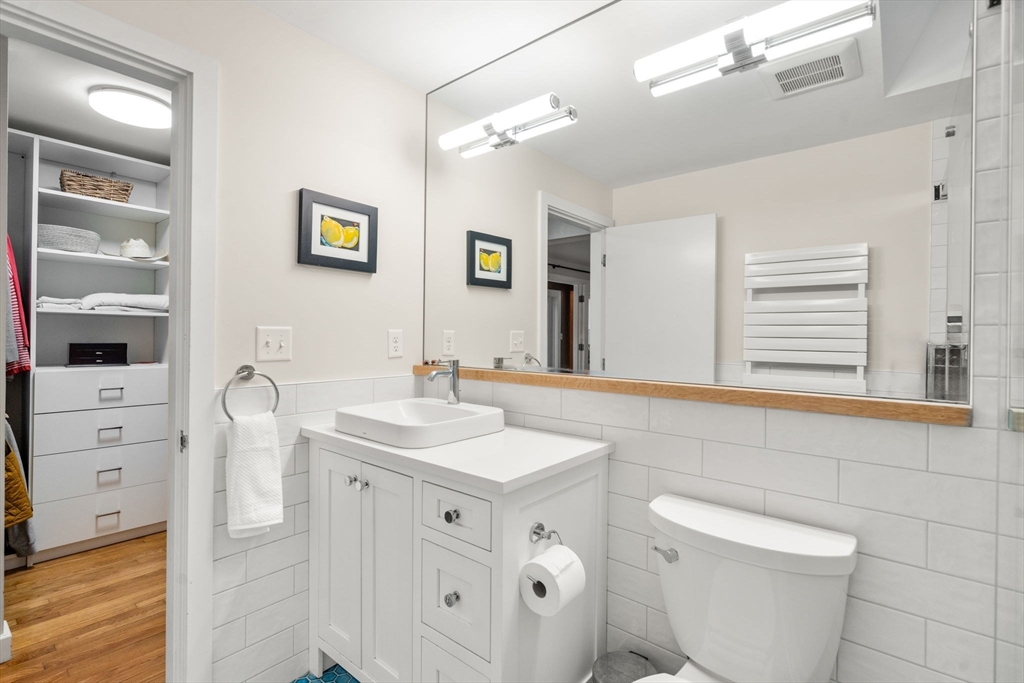 26 Jeffrey Road Wayland, MA 01778 - Photo 18 of 40 a bathroom with a toilet sink and mirror