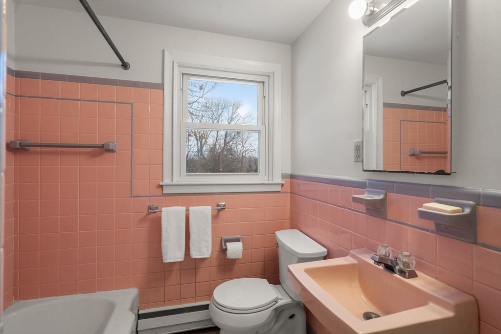 26 Jeffrey Road Wayland, MA 01778 - Photo 21 of 40 a bathroom with a toilet a sink and mirror