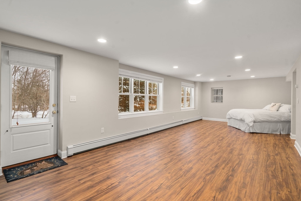 26 Jeffrey Road Wayland, MA 01778 - Photo 26 of 40 a view of a bedroom with wooden floor and window