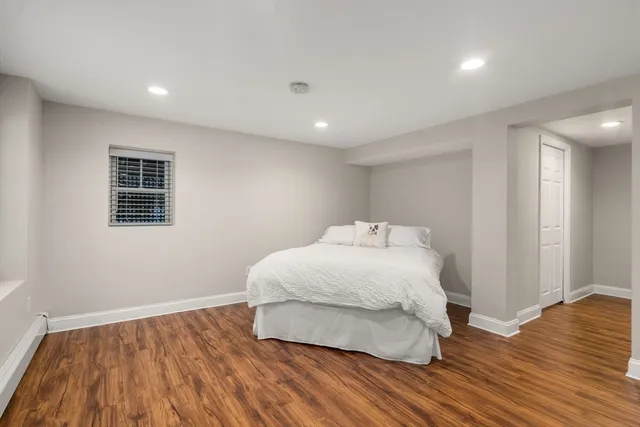 a bathroom with a sink toilet and mirror