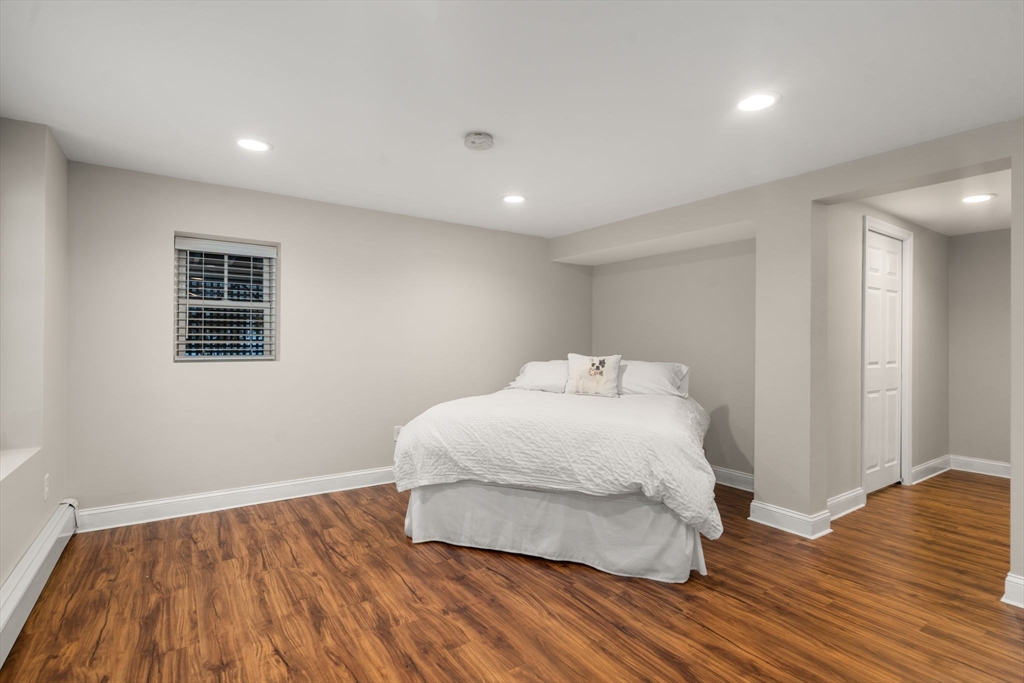 26 Jeffrey Road Wayland, MA 01778 - Photo 27 of 40 a bedroom with a bed and wooden floor
