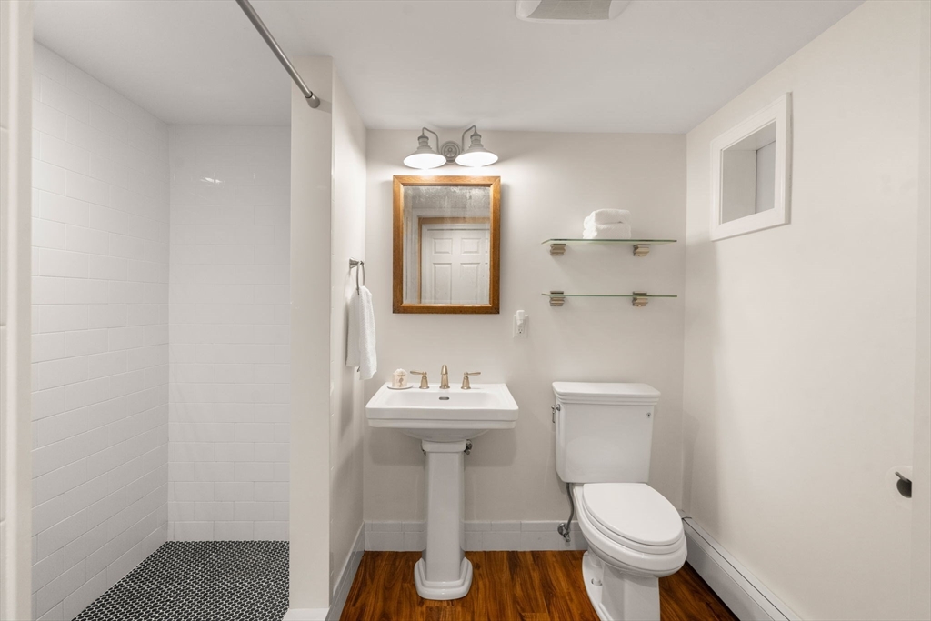 26 Jeffrey Road Wayland, MA 01778 - Photo 28 of 40 a bathroom with a sink toilet and mirror