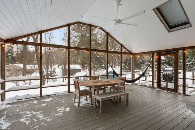 a view of a white house with large windows