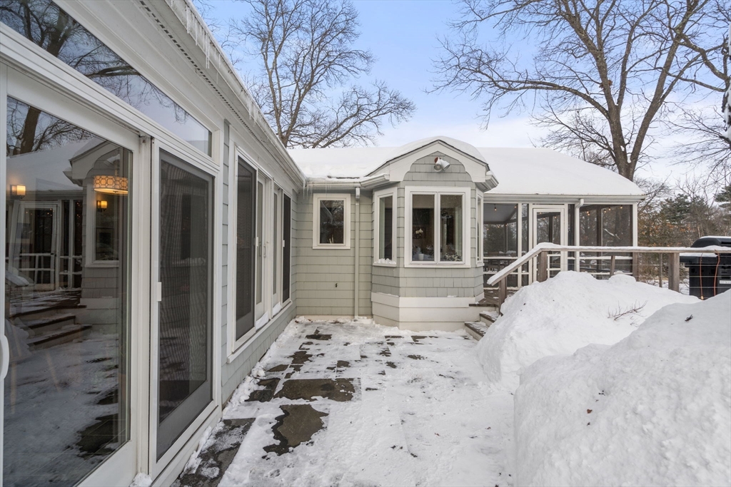 26 Jeffrey Road Wayland, MA 01778 - Photo 34 of 40 a view of a white house with large windows